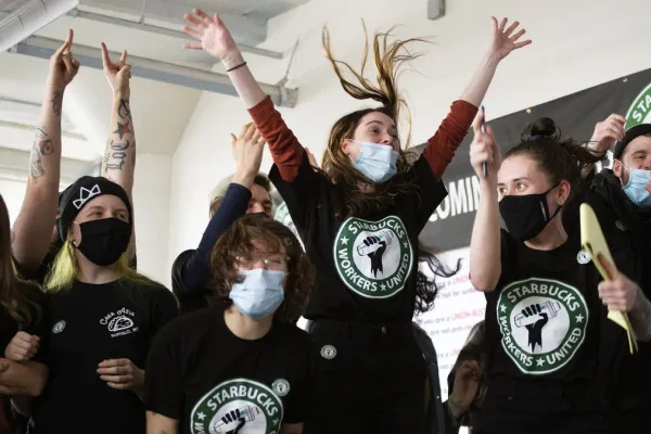 Starbucks Workers United workers celebrate as they secure their first organizing victory in Buffalo, New York in December 2021.