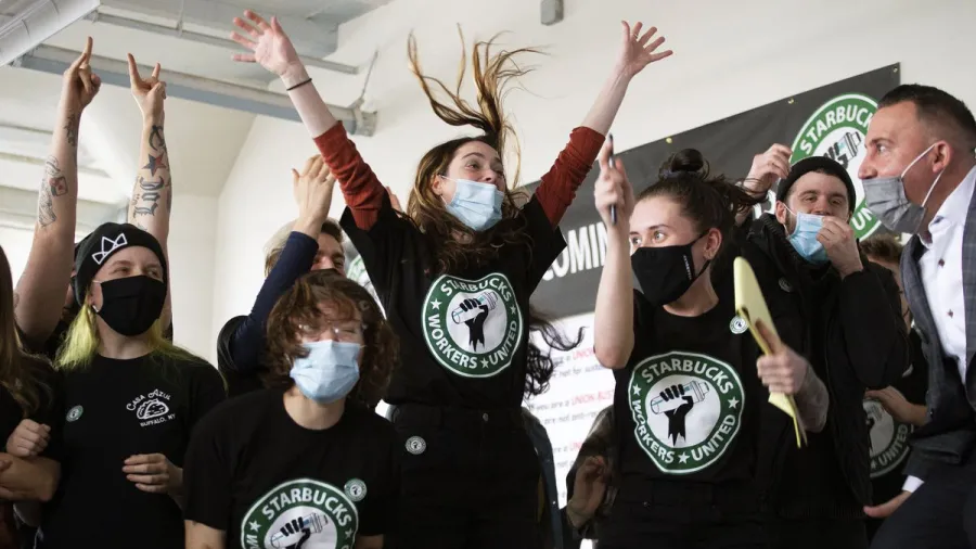 Starbucks Workers United workers celebrate as they secure their first organizing victory in Buffalo, New York in December 2021.