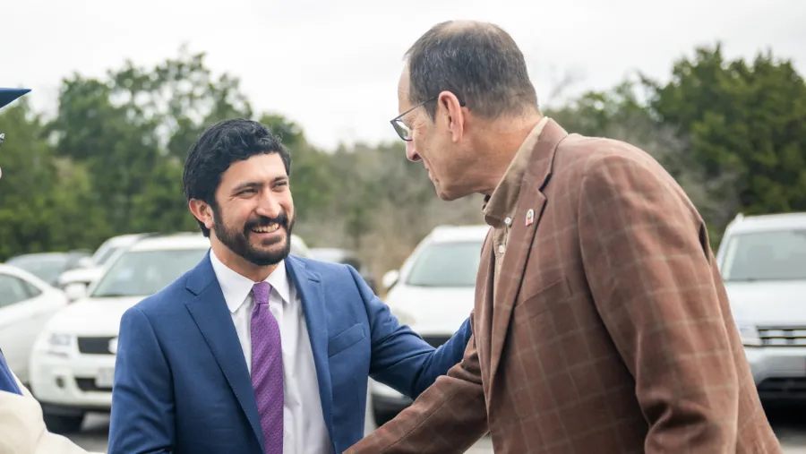 Congressman Greg Casar shakes hands with Texas AFL-CIO President Rick Levy.